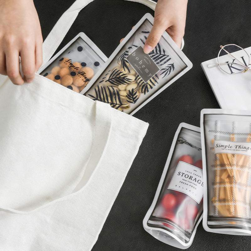 Durable silicone reusable ziplock bags with cup shape, double sealing, and writable surface pocket for storage.