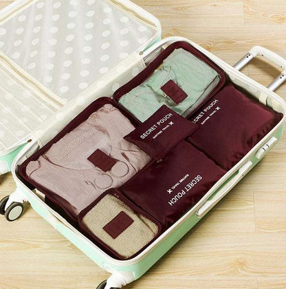 Durable waterproof nylon packing cubes organizing clothes in a suitcase.