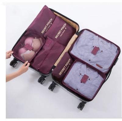 Packing cubes in a suitcase, designed for organized travel with waterproof nylon material.