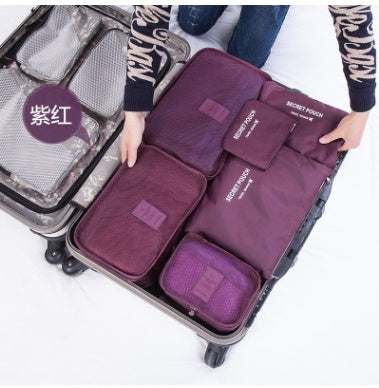 Durable waterproof nylon packing cube travel organizer bag set in suitcase.