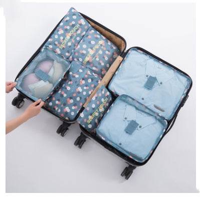 Durable waterproof nylon packing cube travel organizer set in suitcase.