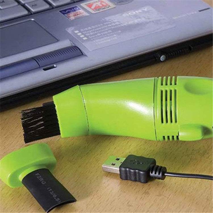 Mini vacuum cleaner for keyboards and laptops, USB-powered.