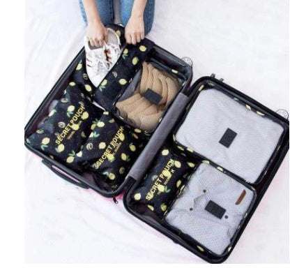 Opened suitcase with durable waterproof nylon packing cubes and clothes organized inside.