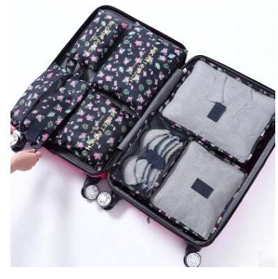 Nylon travel packing cubes organizing luggage in suitcase.