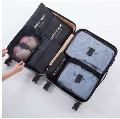 Durable waterproof nylon packing cube travel organizer in suitcase.