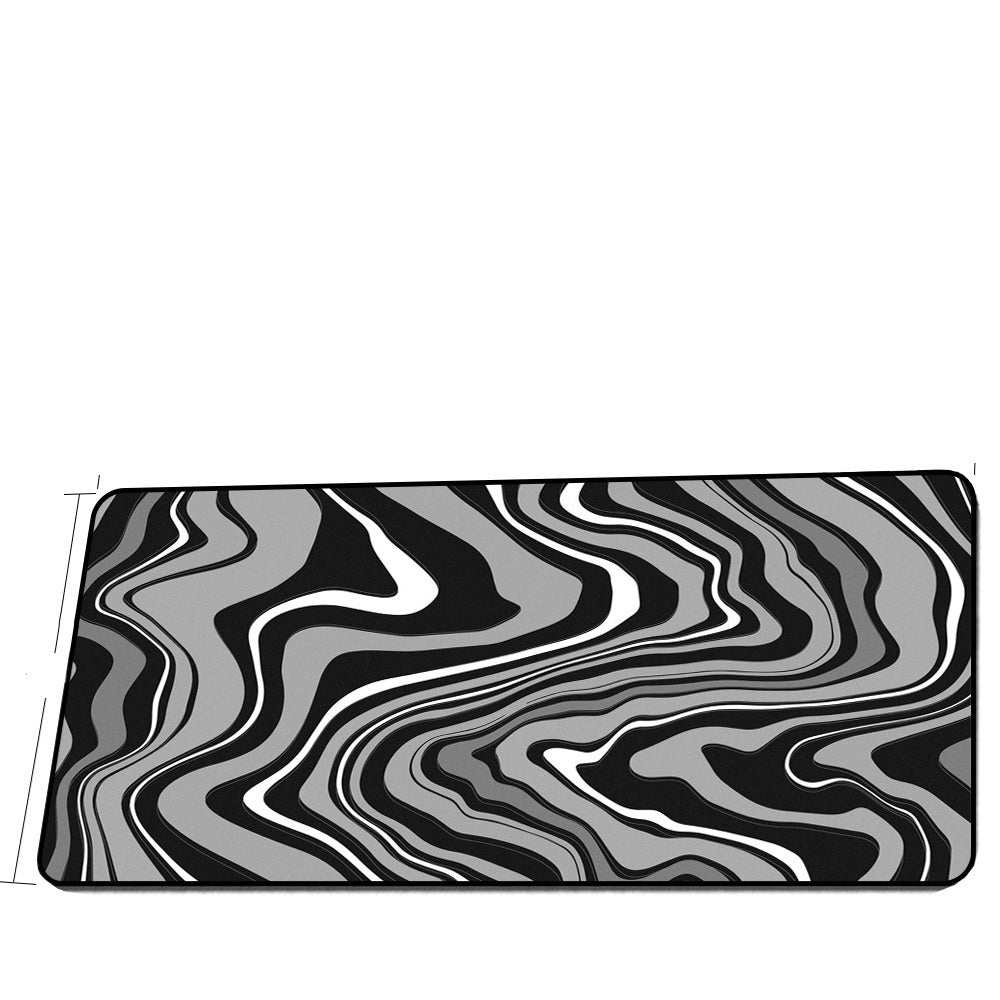 Extra long black and gray swirl design mouse pad for gaming.