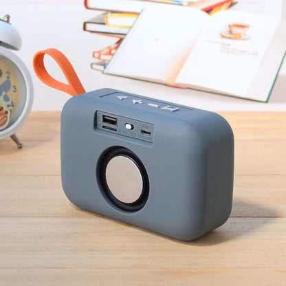 Portable Bluetooth speaker with USB interface, 600mAh battery, and call function.