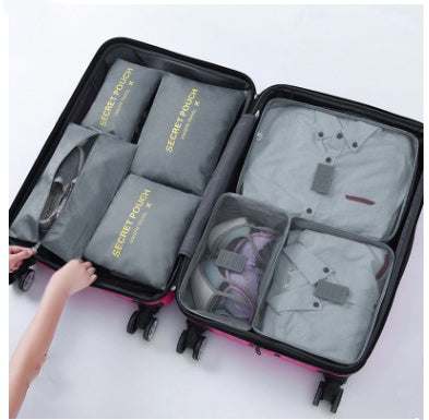 Waterproof nylon packing cubes in suitcase for organized travel.