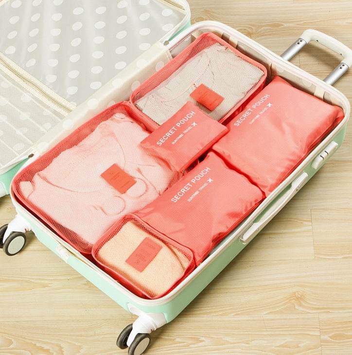 Nylon waterproof packing cubes in a suitcase, showcasing organized travel storage.