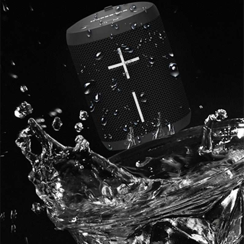 Waterproof P14 wireless Bluetooth speaker in black with water splashing.