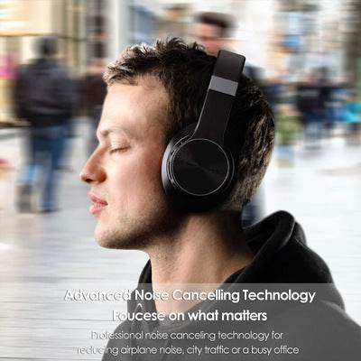 Black sports noise cancelling Bluetooth earphones in use.